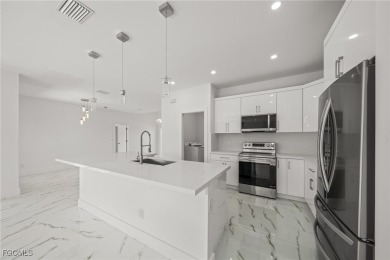 Stunning brand new modern home offering 3 bedrooms plus a on Del Tura Golf and Country Club in Florida - for sale on GolfHomes.com, golf home, golf lot