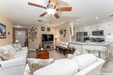 Inviting lakefront home with golf course views, set along a on South Padre Island Golf Club in Texas - for sale on GolfHomes.com, golf home, golf lot