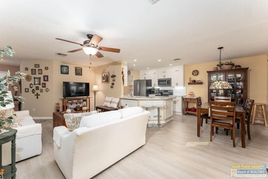 Inviting lakefront home with golf course views, set along a on South Padre Island Golf Club in Texas - for sale on GolfHomes.com, golf home, golf lot