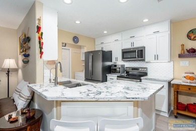 Inviting lakefront home with golf course views, set along a on South Padre Island Golf Club in Texas - for sale on GolfHomes.com, golf home, golf lot