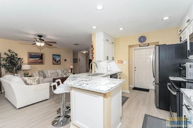 Inviting lakefront home with golf course views, set along a on South Padre Island Golf Club in Texas - for sale on GolfHomes.com, golf home, golf lot