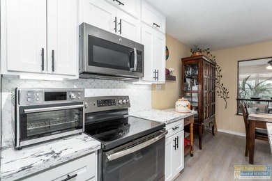 Inviting lakefront home with golf course views, set along a on South Padre Island Golf Club in Texas - for sale on GolfHomes.com, golf home, golf lot