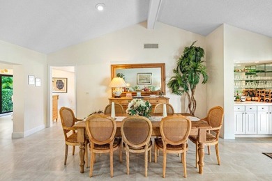 Discover the ultimate blend of elegance and effortless living in on Quail Ridge Golf Course and Country Club in Florida - for sale on GolfHomes.com, golf home, golf lot