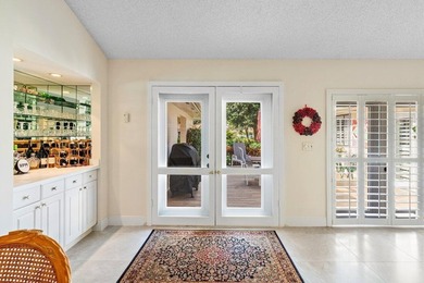 Discover the ultimate blend of elegance and effortless living in on Quail Ridge Golf Course and Country Club in Florida - for sale on GolfHomes.com, golf home, golf lot