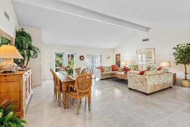 Discover the ultimate blend of elegance and effortless living in on Quail Ridge Golf Course and Country Club in Florida - for sale on GolfHomes.com, golf home, golf lot