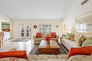 Discover the ultimate blend of elegance and effortless living in on Quail Ridge Golf Course and Country Club in Florida - for sale on GolfHomes.com, golf home, golf lot