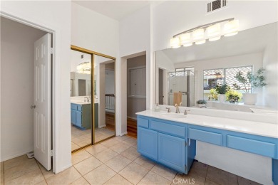 Turquoise double doors welcome you to this cheery 2 story on Wood Ranch Golf Club in California - for sale on GolfHomes.com, golf home, golf lot