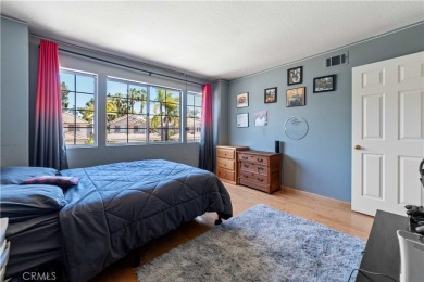 Turquoise double doors welcome you to this cheery 2 story on Wood Ranch Golf Club in California - for sale on GolfHomes.com, golf home, golf lot