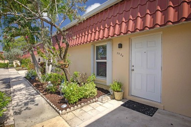 Open the door to this beautifully renovated 1/1.5 bath condo and on Poinciana Golf Club in Florida - for sale on GolfHomes.com, golf home, golf lot