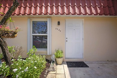 Open the door to this beautifully renovated 1/1.5 bath condo and on Poinciana Golf Club in Florida - for sale on GolfHomes.com, golf home, golf lot
