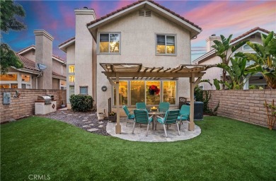 Turquoise double doors welcome you to this cheery 2 story on Wood Ranch Golf Club in California - for sale on GolfHomes.com, golf home, golf lot