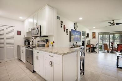 Open the door to this beautifully renovated 1/1.5 bath condo and on Poinciana Golf Club in Florida - for sale on GolfHomes.com, golf home, golf lot