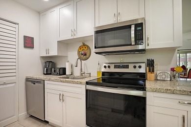 Open the door to this beautifully renovated 1/1.5 bath condo and on Poinciana Golf Club in Florida - for sale on GolfHomes.com, golf home, golf lot