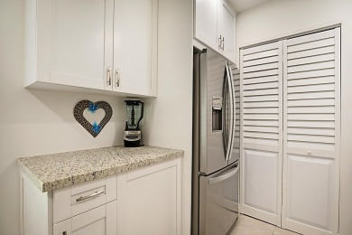 Open the door to this beautifully renovated 1/1.5 bath condo and on Poinciana Golf Club in Florida - for sale on GolfHomes.com, golf home, golf lot