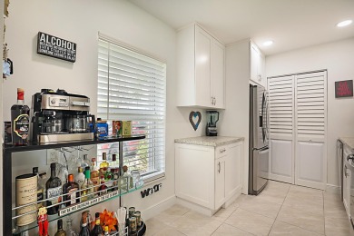 Open the door to this beautifully renovated 1/1.5 bath condo and on Poinciana Golf Club in Florida - for sale on GolfHomes.com, golf home, golf lot