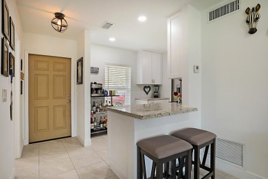 Open the door to this beautifully renovated 1/1.5 bath condo and on Poinciana Golf Club in Florida - for sale on GolfHomes.com, golf home, golf lot