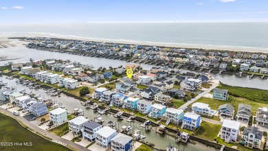 Luxurious Island Living in Sunset Beach: A Stunning 6-Bedroom, 6 on Oyster Bay Golf Links in North Carolina - for sale on GolfHomes.com, golf home, golf lot