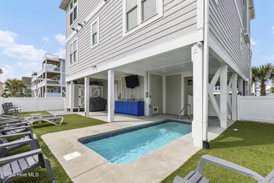 Luxurious Island Living in Sunset Beach: A Stunning 6-Bedroom, 6 on Oyster Bay Golf Links in North Carolina - for sale on GolfHomes.com, golf home, golf lot