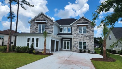 Welcome to this beautifully crafted custom home in the on Wild Wing Plantation in South Carolina - for sale on GolfHomes.com, golf home, golf lot