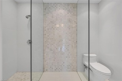 Gallery-inspired design meets effortless livability in this on Bonita Bay West in Florida - for sale on GolfHomes.com, golf home, golf lot