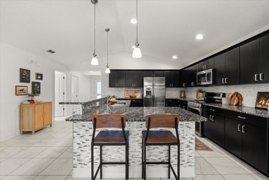 Step inside this beautifully updated Deer Island home, where on Deer Island Country Club in Florida - for sale on GolfHomes.com, golf home, golf lot