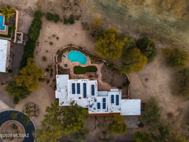 Luxurious Home with Breathtaking Views is nestled in a large on Oro Valley Country Club in Arizona - for sale on GolfHomes.com, golf home, golf lot