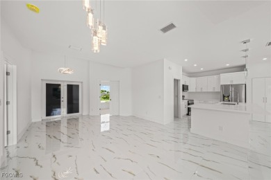 Stunning brand new modern home offering 3 bedrooms plus a on Del Tura Golf and Country Club in Florida - for sale on GolfHomes.com, golf home, golf lot