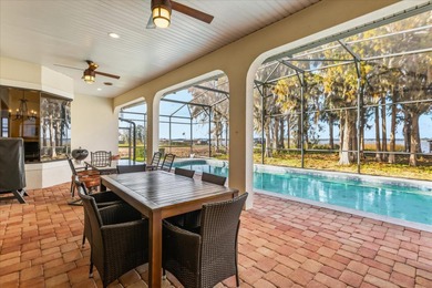 Set along approximately 82 feet of shimmering Lake Dora on Deer Island Country Club in Florida - for sale on GolfHomes.com, golf home, golf lot