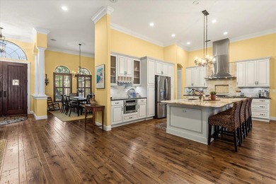 Set along approximately 82 feet of shimmering Lake Dora on Deer Island Country Club in Florida - for sale on GolfHomes.com, golf home, golf lot