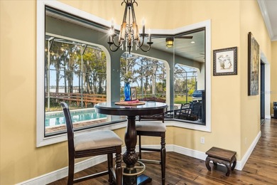 Set along approximately 82 feet of shimmering Lake Dora on Deer Island Country Club in Florida - for sale on GolfHomes.com, golf home, golf lot