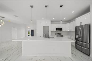 Stunning brand new modern home offering 3 bedrooms plus a on Del Tura Golf and Country Club in Florida - for sale on GolfHomes.com, golf home, golf lot