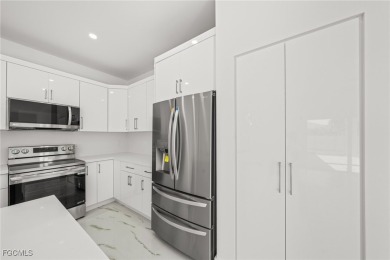 Stunning brand new modern home offering 3 bedrooms plus a on Del Tura Golf and Country Club in Florida - for sale on GolfHomes.com, golf home, golf lot