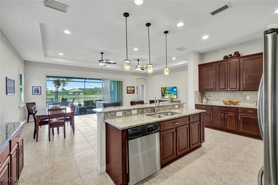 Immaculate lakefront San Remo floor plan home built by WCI on Pelican Preserve Golf Club in Florida - for sale on GolfHomes.com, golf home, golf lot