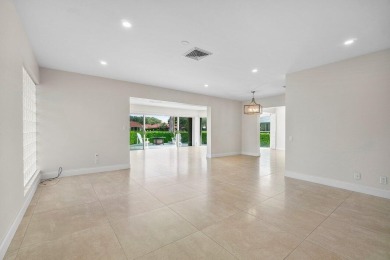 Waterfront Gem with Unmatched Golf & Lake Views!Discover the on Atlantis Golf Club in Florida - for sale on GolfHomes.com, golf home, golf lot