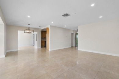 Waterfront Gem with Unmatched Golf & Lake Views!Discover the on Atlantis Golf Club in Florida - for sale on GolfHomes.com, golf home, golf lot