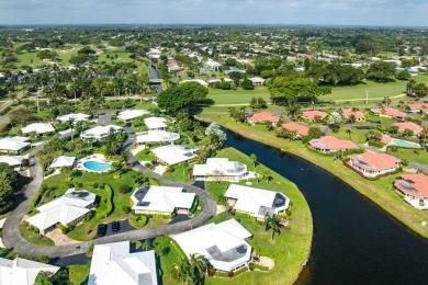 Waterfront Gem with Unmatched Golf & Lake Views!Discover the on Atlantis Golf Club in Florida - for sale on GolfHomes.com, golf home, golf lot