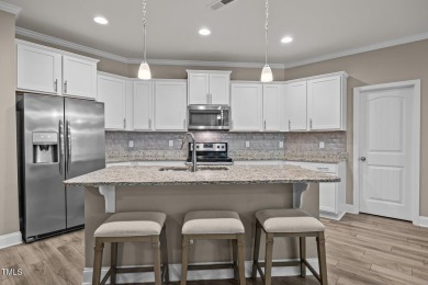 This elegant ranch-style home is located in the highly coveted on Olde Liberty Golf and Country Club in North Carolina - for sale on GolfHomes.com, golf home, golf lot