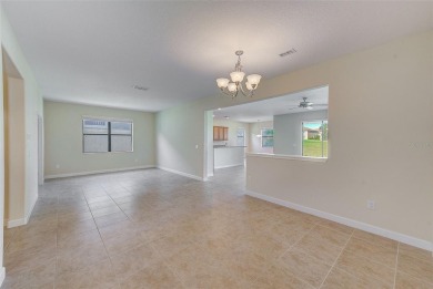 Want to live like you've retired to the house of your dreams on The Oasis Club at Champions Gate in Florida - for sale on GolfHomes.com, golf home, golf lot