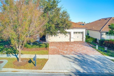 Want to live like you've retired to the house of your dreams on The Oasis Club at Champions Gate in Florida - for sale on GolfHomes.com, golf home, golf lot