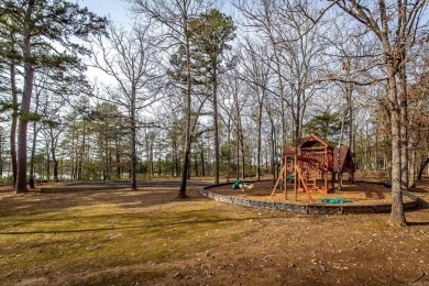 Adorable Cabin in the woods with red line behind the house and on Tannenbaum Golf Club in Arkansas - for sale on GolfHomes.com, golf home, golf lot