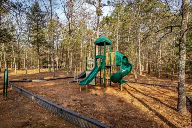 Adorable Cabin in the woods with red line behind the house and on Tannenbaum Golf Club in Arkansas - for sale on GolfHomes.com, golf home, golf lot