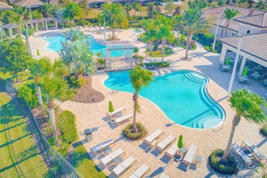Want to live like you've retired to the house of your dreams on The Oasis Club at Champions Gate in Florida - for sale on GolfHomes.com, golf home, golf lot