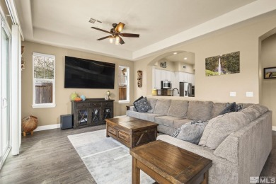Nestled in a gated Somersett community, this charming home on Somersett Country Club in Nevada - for sale on GolfHomes.com, golf home, golf lot