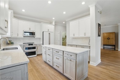 Welcome home to this elegant $100k remodel, first-floor on Quail West Golf and Country Club in Florida - for sale on GolfHomes.com, golf home, golf lot