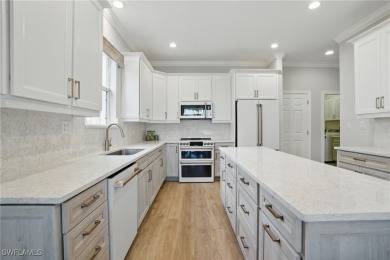 Welcome home to this elegant $100k remodel, first-floor on Quail West Golf and Country Club in Florida - for sale on GolfHomes.com, golf home, golf lot