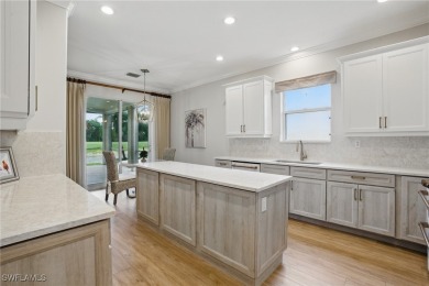 Welcome home to this elegant $100k remodel, first-floor on Quail West Golf and Country Club in Florida - for sale on GolfHomes.com, golf home, golf lot