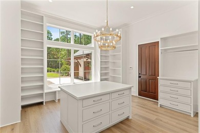 Step into a world of refined elegance with this stunning on Frederica Golf Club in Georgia - for sale on GolfHomes.com, golf home, golf lot