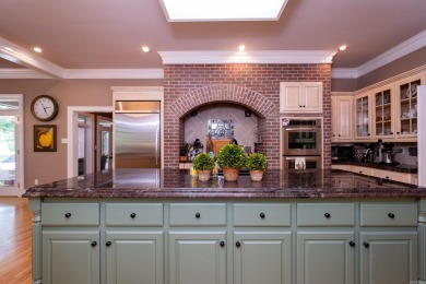 This stunning custom home on the prestigious Founder's Course of on Chenal Country Club - Bear Den Mountain in Arkansas - for sale on GolfHomes.com, golf home, golf lot