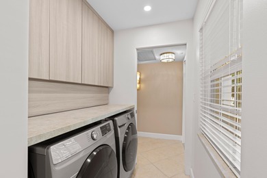 ABSOLUTELY STUNNING WATERFRONT CONDO | BREATHTAKING GOLF COURSE on Palm-Aire Country Club and Resort - The Oaks in Florida - for sale on GolfHomes.com, golf home, golf lot