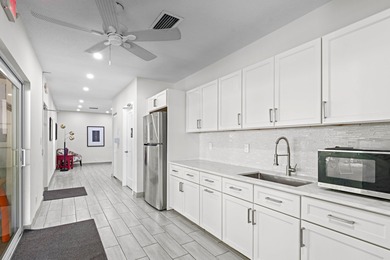 ABSOLUTELY STUNNING WATERFRONT CONDO | BREATHTAKING GOLF COURSE on Palm-Aire Country Club and Resort - The Oaks in Florida - for sale on GolfHomes.com, golf home, golf lot